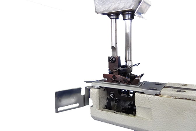 이동 가능 바늘 가드는 스티치 스킵 방지